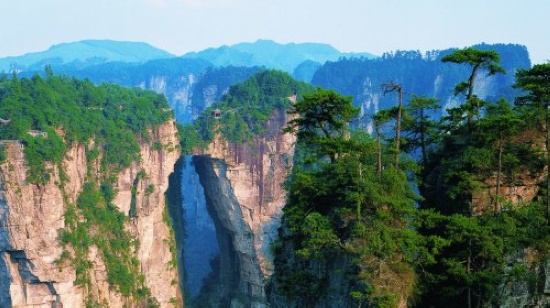 Is it better to stay at Zhangjiajie city or Wulingyuan area? Which is more conve