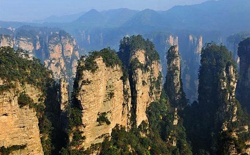 How far to Zhangjiajie national forest park from city and travelling time?