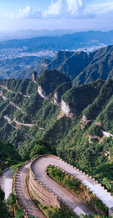 Zhangjiajie,Situated within blue sky, white clouds, mountains and streams