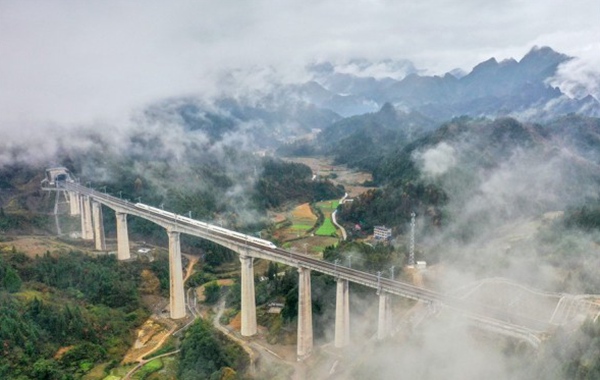 Bullet Train Runs Across Bridge in Longshan County